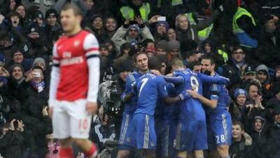 Chelsea's players celebrate Juan Mata's goal against Arsenal. Sang Tan / AP Photo
