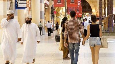 A young couple in Ibn Battuta Mall. A UAE minister told the FNC today that he supports the idea of enforcing a federal law on dress codes in UAE malls. Razan Alzayani / The National