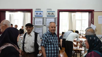 People wait in queue to cast their ballots at a polling station in Yalova, Turkey, on June 24, 2018. Burak Kara / Getty Images
