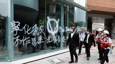 Medics and security officers patrol the campus grounds during an operation to evacuate the Hong Kong Polytechnic University. REUTERS