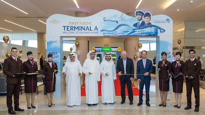 Etihad officials and flight crew pose for a picture after the airline operated its first flight from Terminal A on October 30, 2023. Photo: Etihad