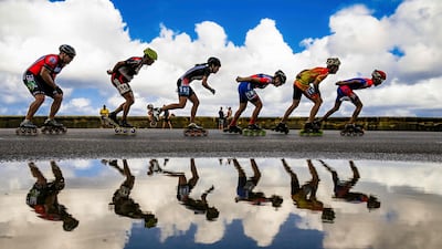 Participants compete during the 2nd Havana International Skate Marathon in Havana on December 4, 2022. (Photo by YAMIL LAGE / AFP)