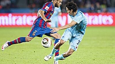 Dani Alves, left, takes on Atlante's Daniel Arreola during the Club World Cup in Abu Dhabi.