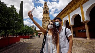 Tourists take a selfie while visiting Cordoba, in Andalusia. EPA