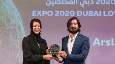 Reem Al Hashimy, Minister of State for International Cooperation and Director General of Expo 2020 Dubai presents an award to one of the top 50 most loyal visitors. Photo by Christopher Edralin/Expo 2020 Dubai