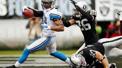 Nate Burleson, left, and the Detroit Lions left the Oakland Raiders in their wake on Sunday.