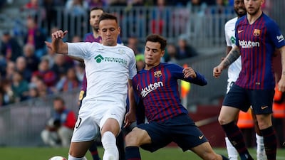 Philippe Coutinho fights for the ball with Nemanja Maksimovic. AP Photo