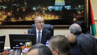 Palestinian Prime Minister, Rami Hamdallah talks during the first cabinet meeting of the new Palestinian unity government in the West Bank city of Ramallah on June 3, 2014. AFP