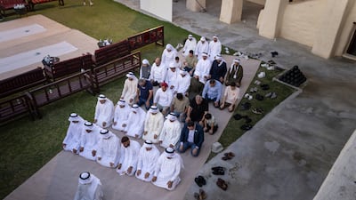 Emirati families, members of the Umm Al Quwain Youth Council and non-Muslim residents gather for a traditional iftar at Umm Al Quwain Museum. All photos: Antonie Robertson / The National