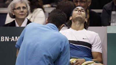 Rafael Nadal receives treatment on his right leg during the final of the ABN Amro event in Rotterdam. The injury could see him miss the Dubai Tennis Championships.