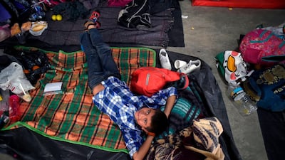 A Central American migrant boy rests at a temporary shelter in Irapuato, Guanajuato state, Mexico. AFP