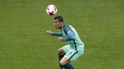 Portugal's Cristiano Ronaldo jumps for the ball during the Confederations Cup match against Russia. AP Photo