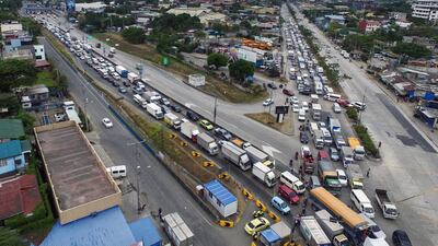 This aerial photo shows traffic congestion from vehicles waiting to clear checkpoints, part of measures to reduce the spread of the COVID-19 pandemic, before entering Manila. AFP