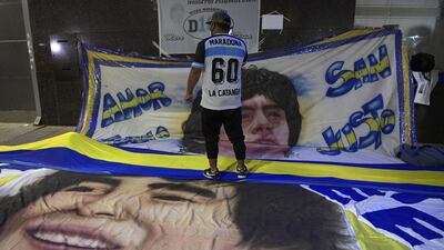 Large banners of Diego Maradona are placed outside the hospital where he undergoes a brain surgery for a blood clot, in Olivos, Buenos Aires. AFP