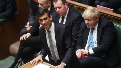 Britain's Prime Minister Boris Johnson looks on as Britain's Chancellor of the Exchequer Rishi Sunak presents the Spring Budget statement to MPs at the House of Commons, in London, on March 23. AFP