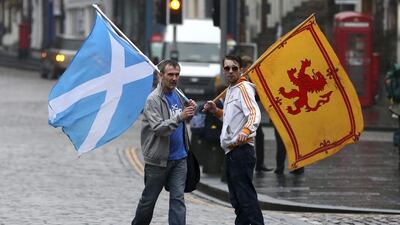 Supporters of the Yes campaign for the Scottish independence referendum stand on the Royal Mile in Edinburgh. Scott Heppell / AP Photo