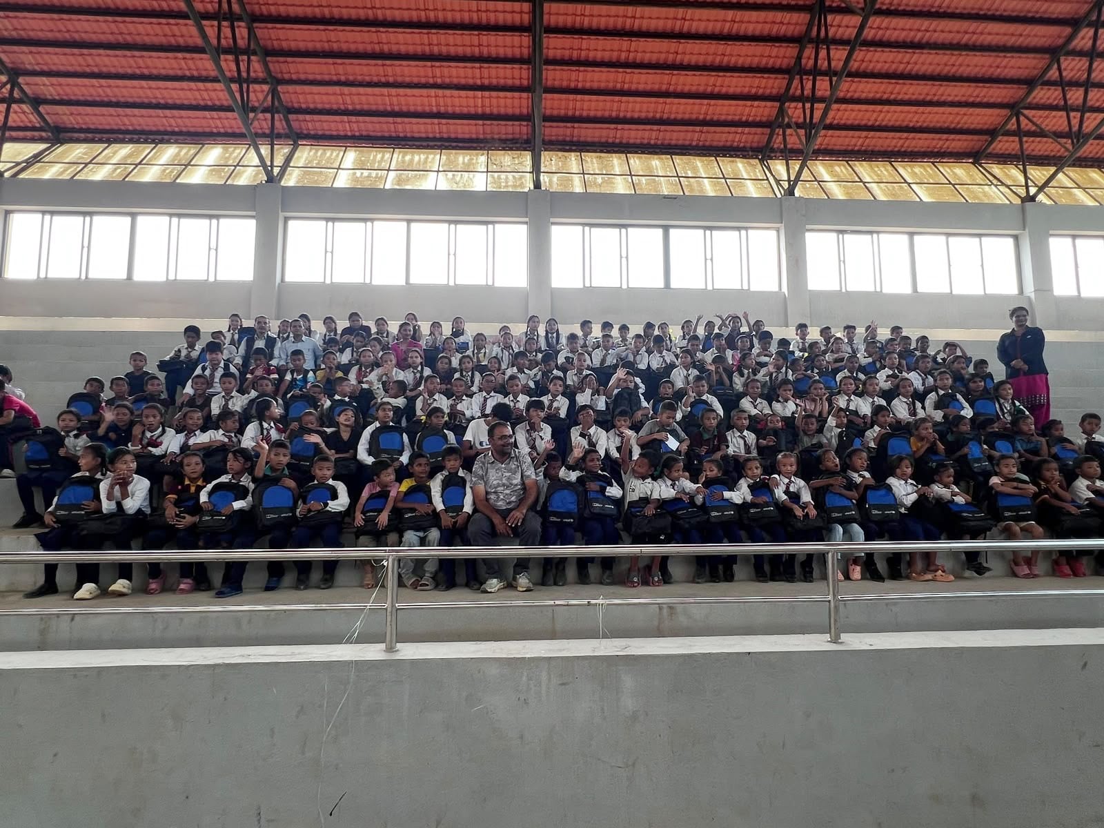 Children cheer and clap when classes resumed on September 21 in a sports academy and in tents. Photo: Rajendra Dawadi