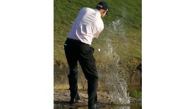 Bill Haas hits from the water on the 17th hole during a play-off against Hunter Mahan in the Tour Championship.Dave Martin / AP Photo