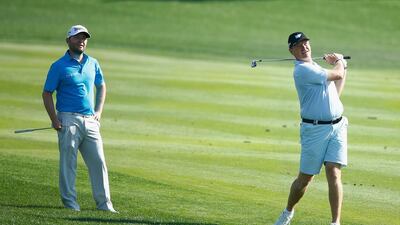 Branden Grace of South Africa and Ernie Els of South Africa watch a shot during a practice round before the start of the Abu Dhabi HSBC Golf Championship at Abu Dhabi Golf Club on January 19, 2016 in Abu Dhabi, United Arab Emirates. Scott Halleran/Getty Images