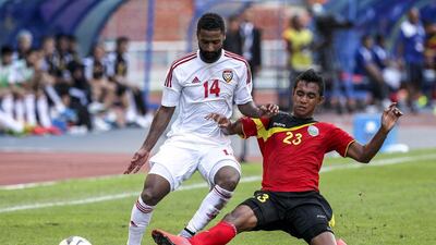 UAE’s Abdelaziz Sangour (L) in action against Timor Leste player Jose Carlos Da Fonseca (R) during the FIFA World Cup 2018 preliminary qualification match between the UAE and Timnor Leste at Shah Alam Stadium outside Kuala Lumpur, Malaysia, 16 June 2015. EPA/STR