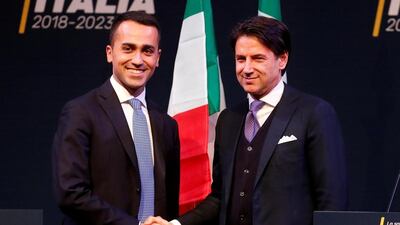Mr Conte, right, must now finalise his cabinet, which has been the subject of days of tough negotiations between the anti-establishment 5-Star Movement and the far-right League coalition that makes up the proposed government. Remo Casilli / Reuters
