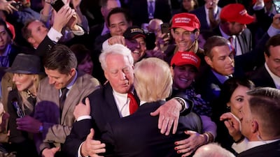 Donald Trump hugs his brother Robert Trump after delivering his acceptance speech in New York City, November 09, 2016. AFP