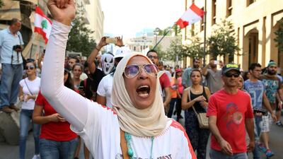 A Lebanese activist protests against the ongoing rubbish crisis in the capital Beirut. There's too much politics in rubbish, argues Faisal Al Yafai (AP Photo/Bilal Hussein)