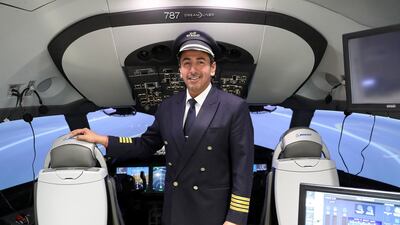 Capt Abdulla Obaid, the Emirati pilot who flew the Pope back to Rome, sits in an Etihad Boeing 787 flight simulator at the carrier's headquarters in Abu Dhabi. Pawan Singh / The National