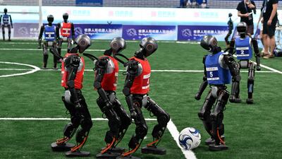 Robots compete in a five-aside football match during the World Humanoid Robot Games in Beijing. AFP