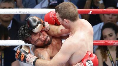 Manny Pacquiao of the Philippines, left, clinches with Jeff Horn of Australia, during their WBO World Welterweight title fight in Brisbane, Australia, Sunday, July 2, 2017.