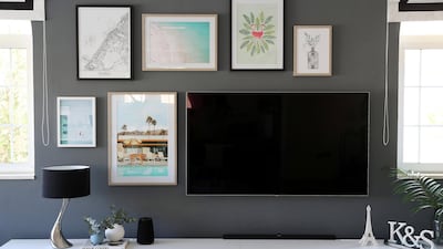 To add texture to the room, mcustom-made, off-white linen curtains with a dark border framed the arched windows. Pawan Singh / The National