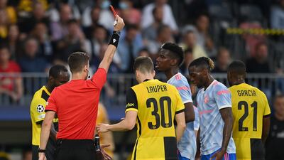 Referee Francois Letexier shows United full-back Aaron Wan-Bissaka a red card. Getty