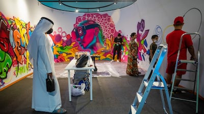 A workshop on graffiti art at World Conference on Creative Economy 2021, Dubai. Victor Besa / The National