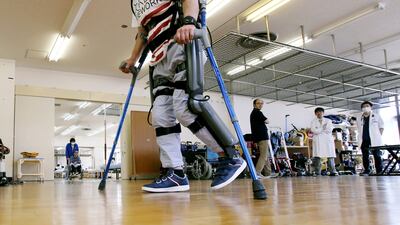 Robotic exoskeletons like the ReWalk, on display here in Tokyo, are helping people to walk again. Shuji Kajiyama / AP