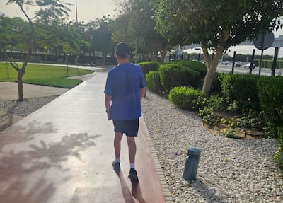 Carl Davies, pictured this week, is walking five kilometres a day for a year to raise awareness and support for younger stroke survivors. Nick March / The National