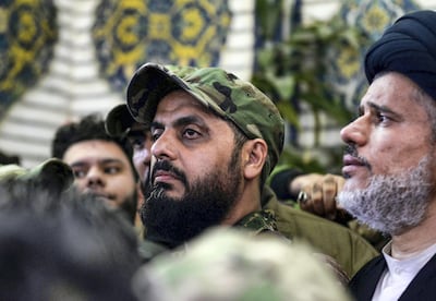 Qais Al Khazali, centre, commander of the Asaib Ahl Al Haq pro-Iran faction. AFP