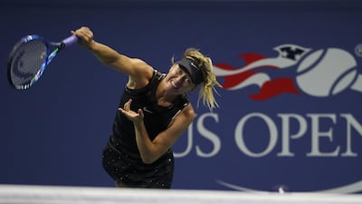 Maria Sharapova serves towards Simona Halep. Geoff Burke / USA TODAY Sports