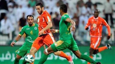 Driss Fettouhi, second from left, scored one of Ajman's goals. Al Ittihad