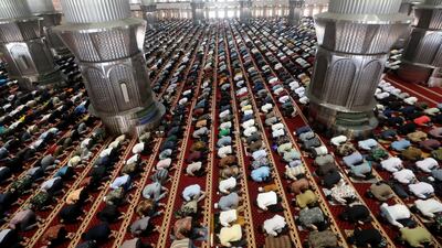 Men attend the first Friday prayers of Ramadan at the Istiqlal Mosque in Jakarta, Indonesia. EPA