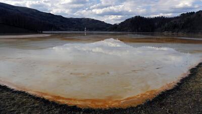 A polluted lake, tainted with cyanide and other chemicals, covers Geamana village near Rosia Montana. Bogdan Cristel / Reuters