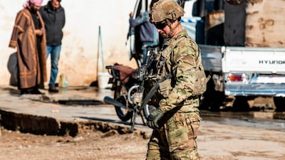 US soldiers patrol a road in the town of Tal Tamr in the northeastern Syrian Hasakeh province on the border with Turkey. AFP