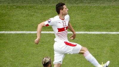 Fabian Schar (up) of Switzerland celebrates after scoring the opening goal during the Uefa Euro 2016 group A preliminary round match between Albania and Switzerland at Stade Bollaert-Delelis in Lens Agglomeration, France, 11 June 2016. Shawn Thew / EPA