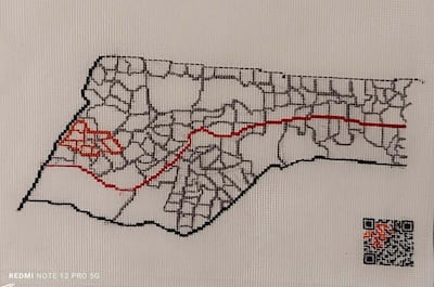 Maps embroidered by Maha Al Daya reproduce leaflets telling Gazans to leave certain zones. Photo: Maha Al-Daya