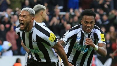 Brazilian striker Joelinton celebrates with Joe Willock (R) after adding third goal. AFP