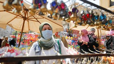 A woman buys traditional Ramadan lanterns, which are displayed at a stall in Cairo, Egypt. Reuters