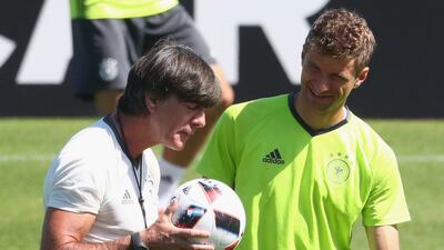 Joachim Low, head coach of Germany talks to his player Thomas Muller prior to a Germany training session ahead of their Uefa Euro 2016 semi-final against France at Ermitage Evian on July 06, 2016 in Evian-les-Bains, France. Alexander Hassenstein / Getty Images