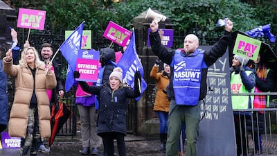 Primary school teachers on a picket line in Glasgow this month. Teachers in England and Wales have now voted for their own walk out. PA