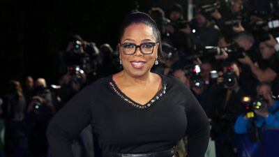 Former first lady Michelle Obama paid homage to Oprah Winfrey, seen here at a 2018 film premiere in London, for having an 'uncanny ability to open us up, to hear beyond our words, and to uncover a higher truth'. AP