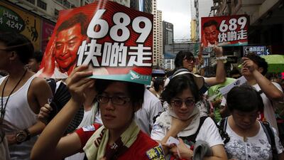 The route from the city’s Victoria Park to the Central business district was a sea of umbrellas and banners such as “We want real democracy” and “We stand united against China”. Bobby Yip/Reuters