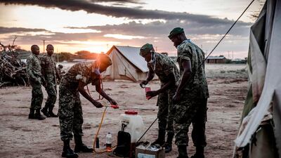 Members of Kenya's NYS -National Youth Service prepare tp spray pesticides to kill the swarms of locusts.